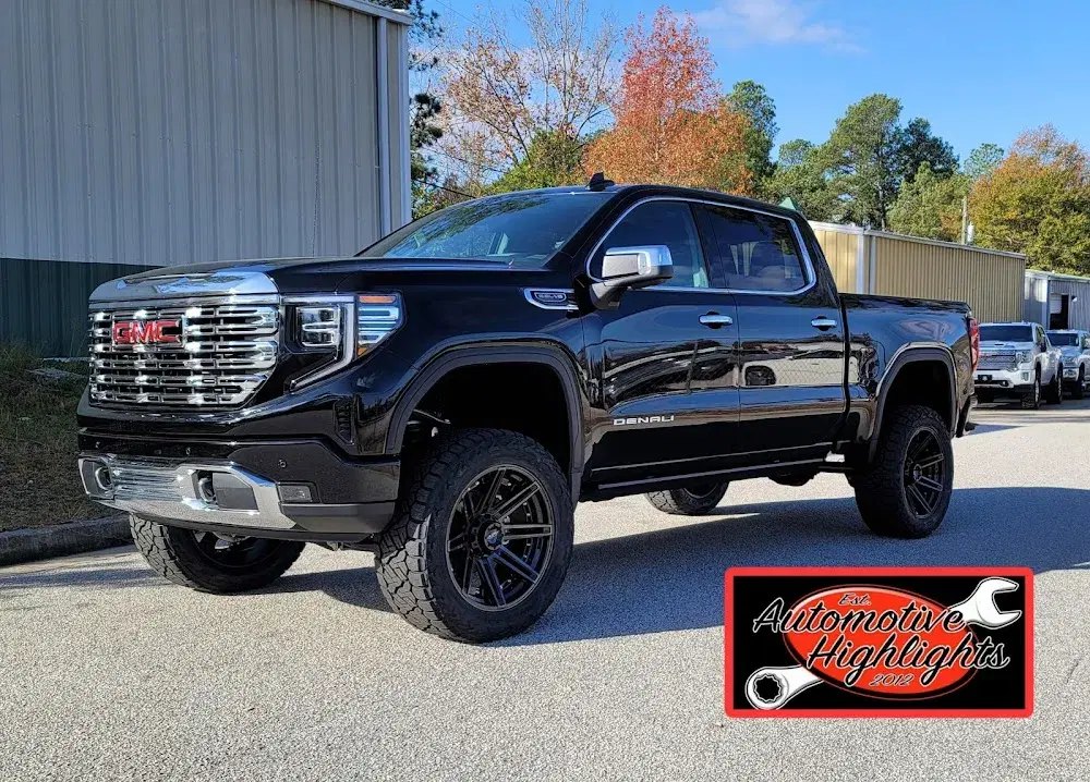 Black GMC Sierra Denali with a lift and black wheels