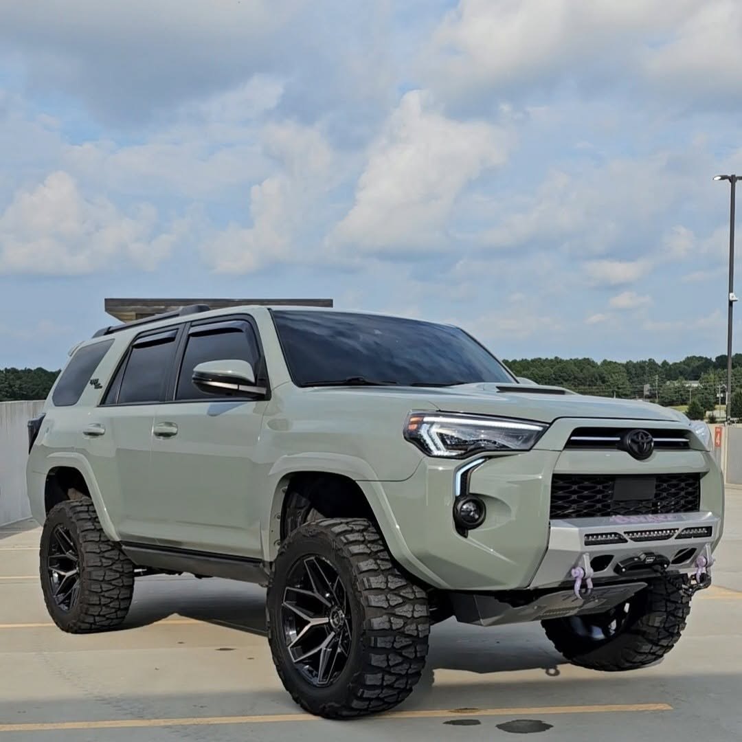 Lifted Toyota 4Runner TRD with aftermarket bumper, winch, and off-road tires